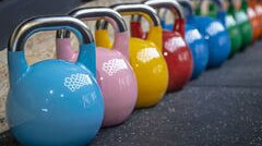 Competition Kettlebells vs. Cast Iron: Choosing the Right Kettlebell for Your Fitness Goals