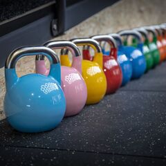 Competition Kettlebells vs. Cast Iron: Choosing the Right Kettlebell for Your Fitness Goals