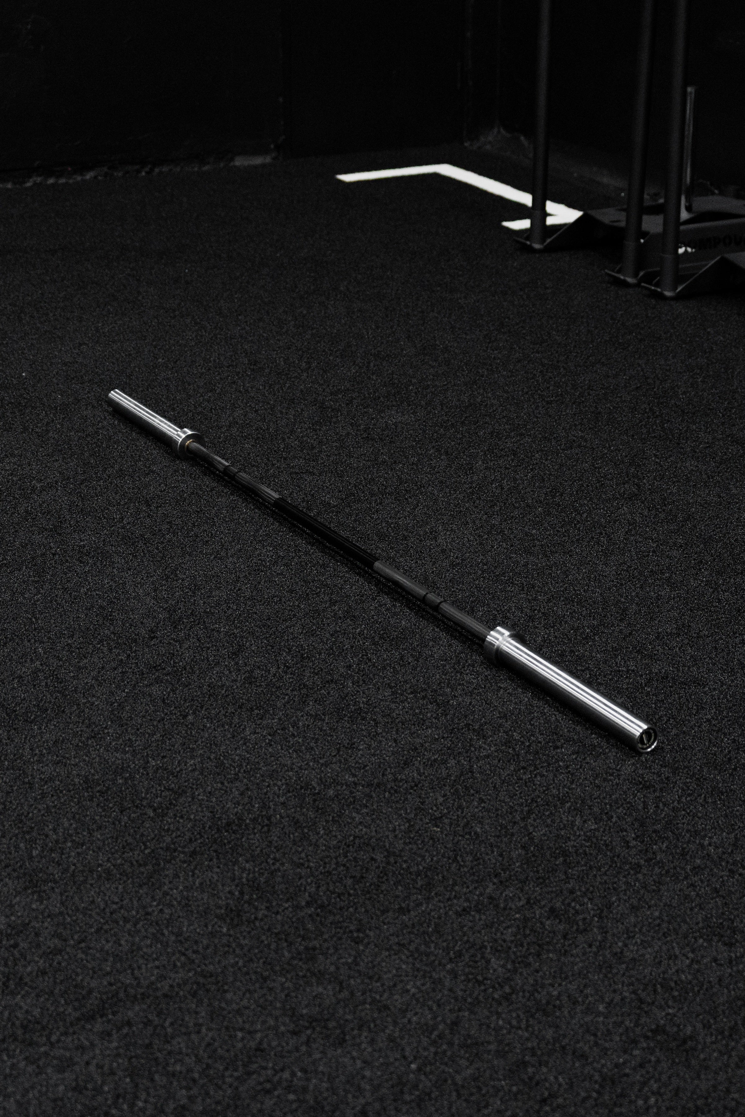 Platinum Olympic Lifting Barbell - Front view of commercial gym equipment