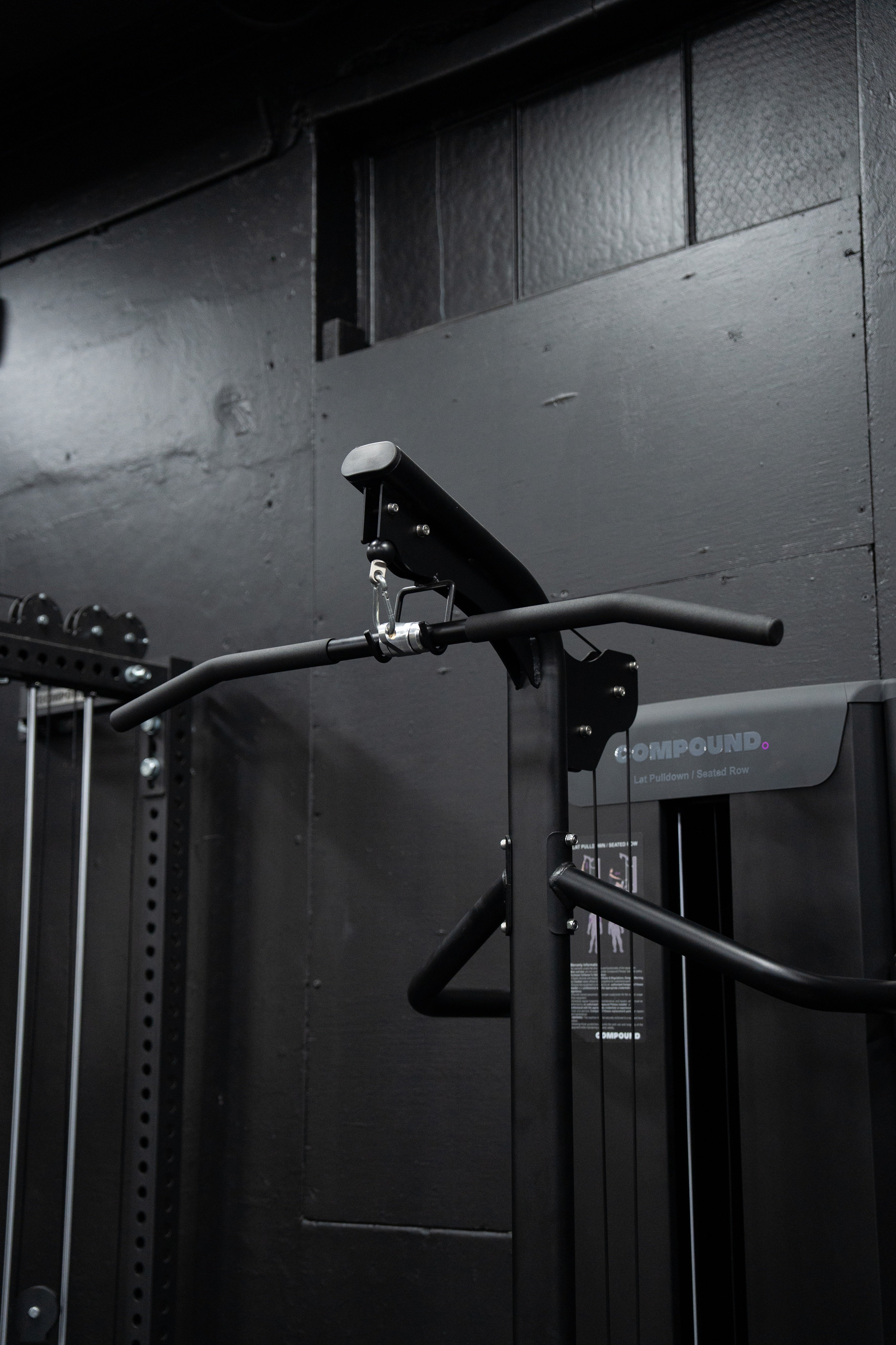 Lat Pulldown / Seated Row - Dynasty side view showing compact footprint design